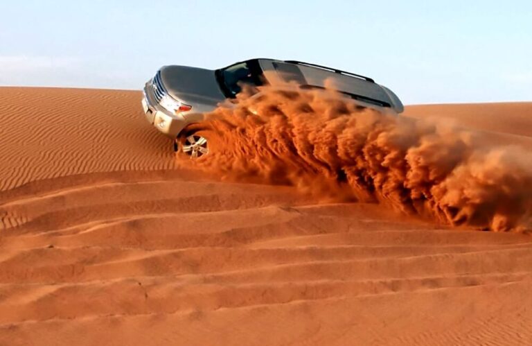 Red dune deserrt safari ride in suv