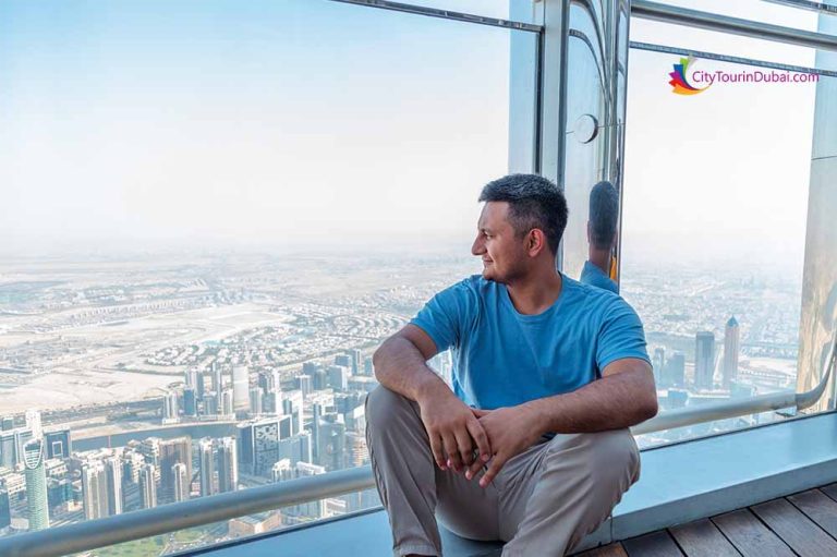 Man Enjoying a view of Burj Khalifa at the Top